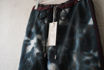 21AW INJECTION DYEING TRACK PANTS レッド / Children of the discordance(チルドレンオブザディスコーダンス)
